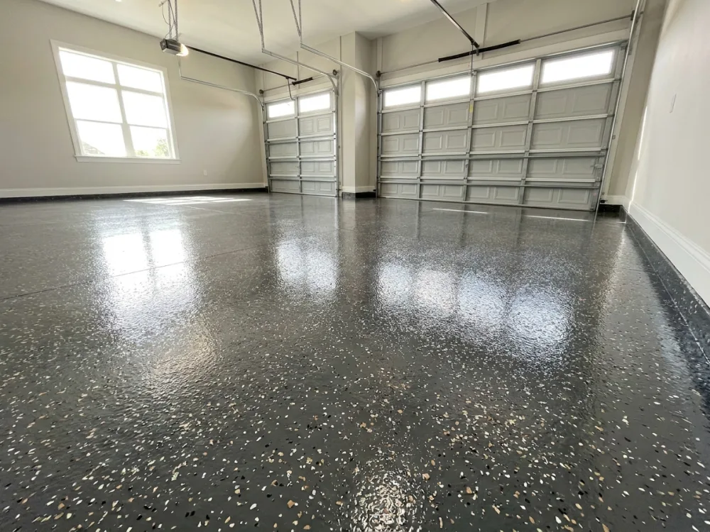 Glossy epoxy garage floor coating in a Lake County three-car garage