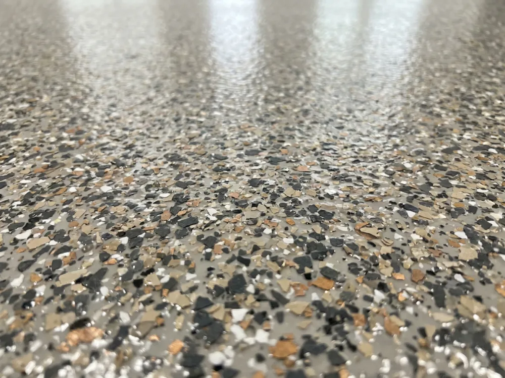 Decorative flake detail on a polyaspartic floor coating